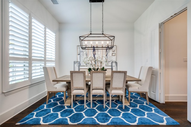 2021 Longmont Ln, Prosper, TX 75078 - dining area with a chandelier, plenty of natural light, and wood finished floors