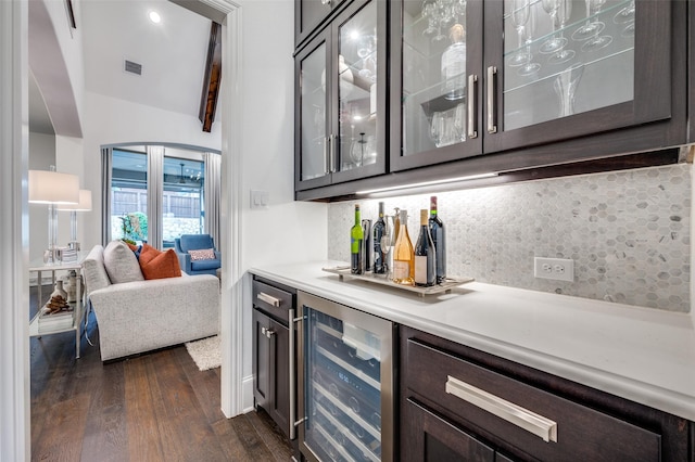 2021 Longmont Ln, Prosper, TX 75078 - indoor dry bar featuring wine cooler, dark wood-type flooring, and decorative backsplash