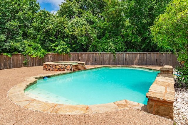 933 Oatlands Pl, Burleson, TX 76028 - view of pool with a fenced backyard and a pool with connected hot tub