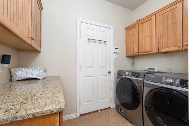 933 Oatlands Pl, Burleson, TX 76028 - washroom featuring washer and clothes dryer, cabinet space, light tile patterned floors, and baseboards