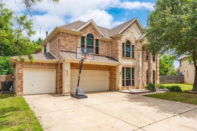933 Oatlands Pl, Burleson, TX 76028 - view of front facade with driveway, roof with shingles, cooling unit, a standing seam roof, and an attached garage