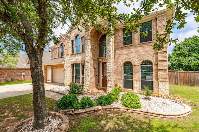 933 Oatlands Pl, Burleson, TX 76028 - traditional-style house with driveway, a garage, brick siding, and stone siding