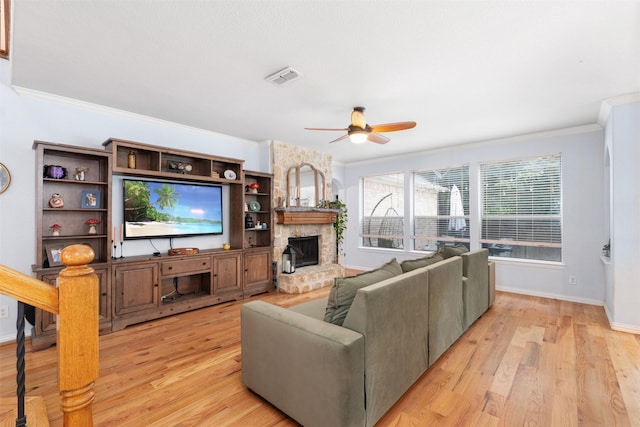 933 Oatlands Pl, Burleson, TX 76028 - living area with a ceiling fan, ornamental molding, light wood-style floors, a fireplace, and baseboards