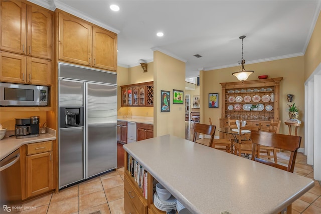 5705 Lake Side Dr, Bossier City, LA 71111 - kitchen featuring stainless steel appliances, light tile patterned flooring, ornamental molding, light countertops, and decorative light fixtures