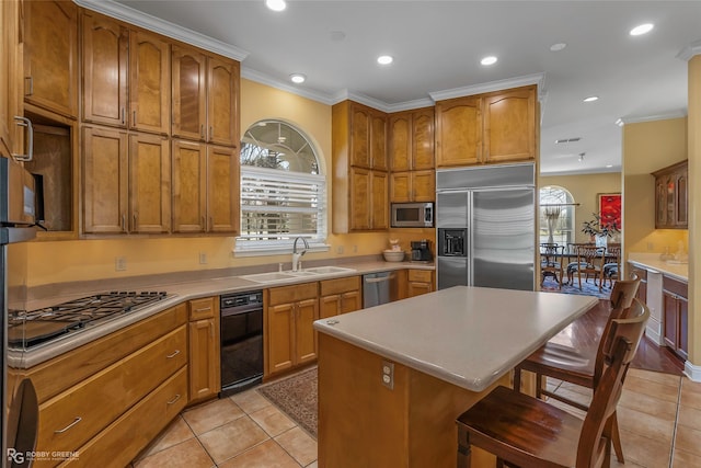 5705 Lake Side Dr, Bossier City, LA 71111 - kitchen featuring built in appliances, a sink, a breakfast bar, light tile patterned floors, and ornamental molding