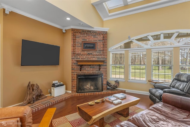 5705 Lake Side Dr, Bossier City, LA 71111 - living area featuring a brick fireplace, ornamental molding, wood finished floors, a skylight, and recessed lighting