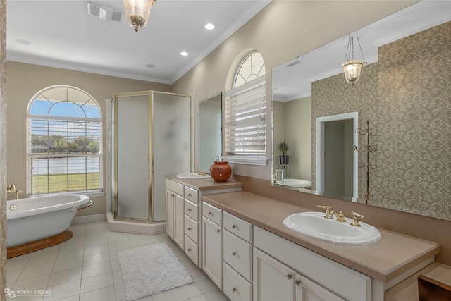 5705 Lake Side Dr, Bossier City, LA 71111 - bathroom with vanity, a stall shower, crown molding, a freestanding bath, and tile patterned flooring