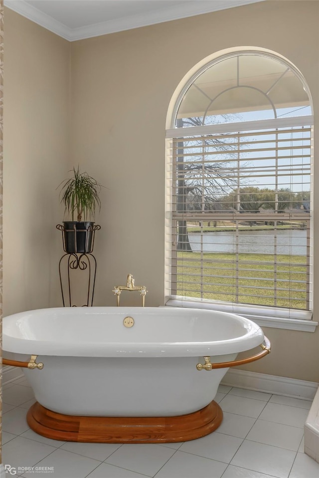 5705 Lake Side Dr, Bossier City, LA 71111 - bathroom with a water view, a soaking tub, tile patterned flooring, ornamental molding, and baseboards