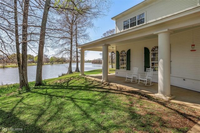 5705 Lake Side Dr, Bossier City, LA 71111 - view of grassy yard with covered porch and a water view
