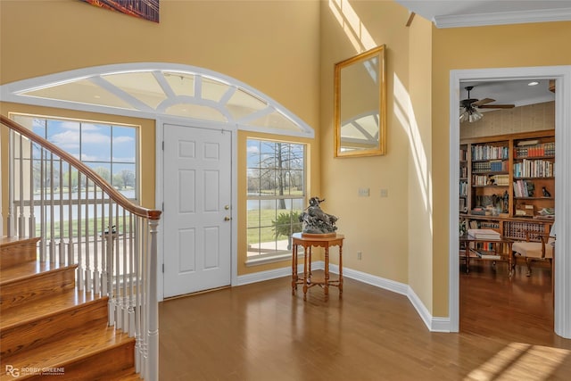 5705 Lake Side Dr, Bossier City, LA 71111 - entryway with ornamental molding, wood finished floors, baseboards, a ceiling fan, and stairway