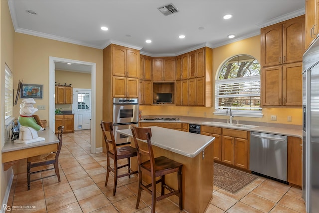 5705 Lake Side Dr, Bossier City, LA 71111 - kitchen with appliances with stainless steel finishes, a sink, a breakfast bar, light tile patterned flooring, and crown molding