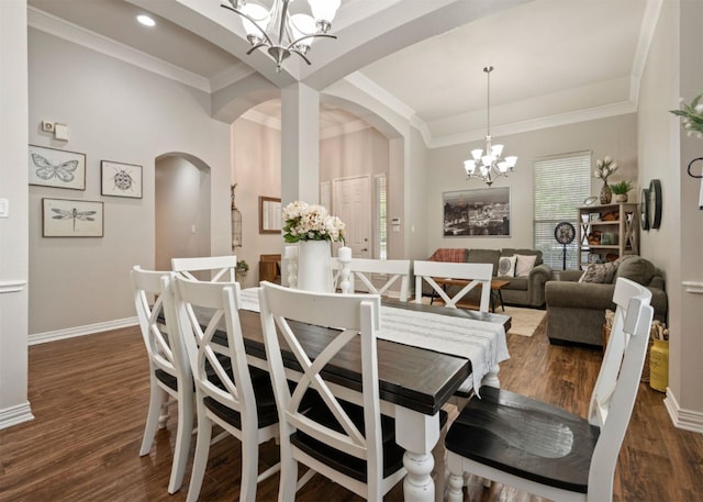 2541 Sir Tristram Ln, Lewisville, TX 75056 - dining area with a chandelier, arched walkways, dark wood-style flooring, crown molding, and recessed lighting