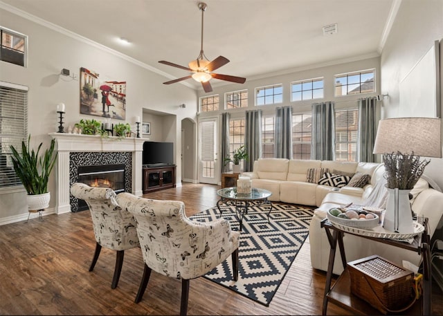 2541 Sir Tristram Ln, Lewisville, TX 75056 - living room with crown molding, wood finished floors, a ceiling fan, and a fireplace