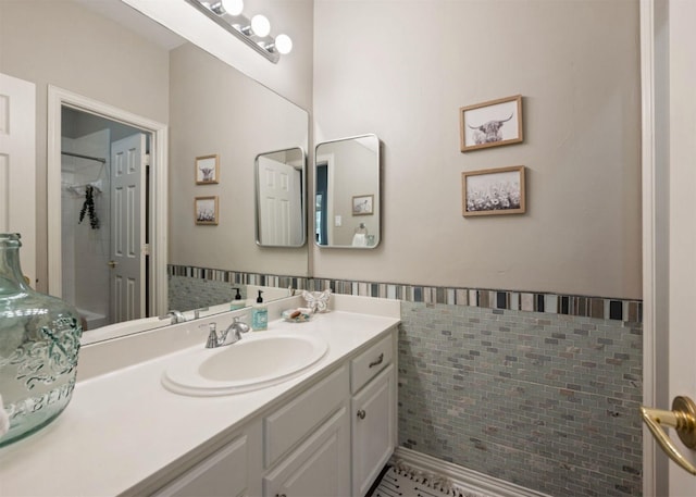 2541 Sir Tristram Ln, Lewisville, TX 75056 - bathroom with tile walls, vanity, wainscoting, and tile patterned floors
