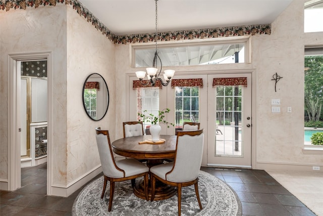 3873 Heritage Trl, Celina, TX 75009 - dining area with a chandelier, french doors, baseboards, and a textured wall