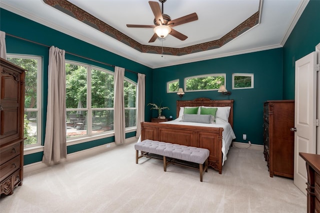 3873 Heritage Trl, Celina, TX 75009 - bedroom with light carpet, baseboards, crown molding, a ceiling fan, and a tray ceiling