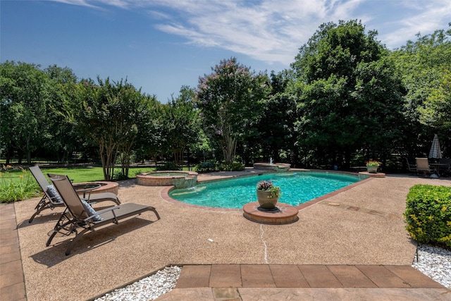 3873 Heritage Trl, Celina, TX 75009 - view of swimming pool with a pool with connected hot tub, a patio area, and view of wooded area