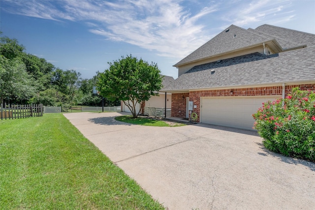 3873 Heritage Trl, Celina, TX 75009 - view of side of property featuring brick siding, roof with shingles, concrete driveway, and an attached garage