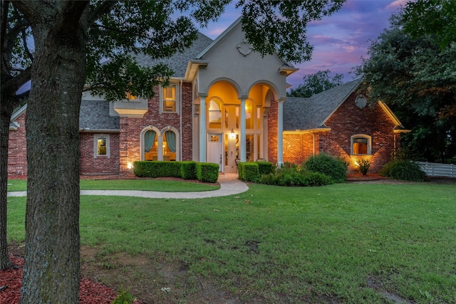 3873 Heritage Trl, Celina, TX 75009 - view of front of property featuring a shingled roof, a yard, brick siding, and stucco siding