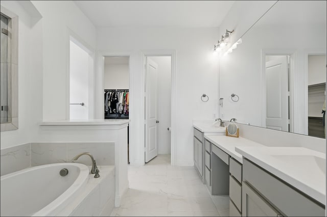 1001 Gentle Knoll Ln, Prosper, TX 75078 - bathroom with marble finish flooring, double vanity, a walk in closet, and a bath