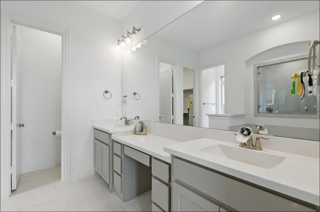 1001 Gentle Knoll Ln, Prosper, TX 75078 - bathroom featuring double vanity, marble look tiles, baseboards, recessed lighting, and a shower