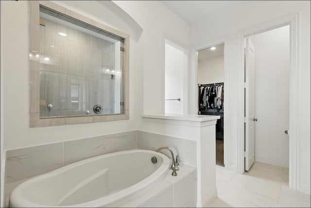 1001 Gentle Knoll Ln, Prosper, TX 75078 - full bathroom with a garden tub, a walk in closet, marble finish floors, tiled shower, and baseboards