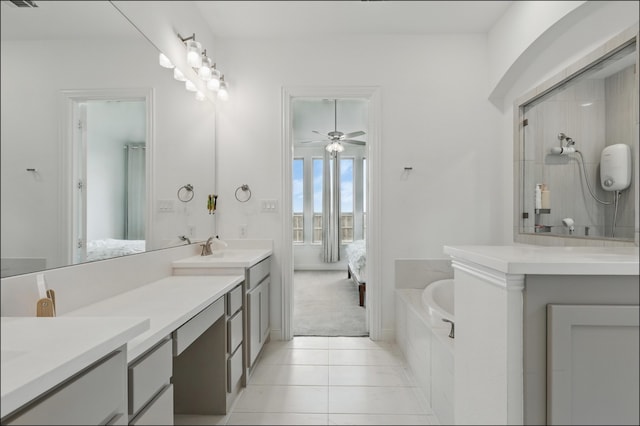 1001 Gentle Knoll Ln, Prosper, TX 75078 - bathroom featuring connected bathroom, double vanity, a bath, and tile patterned floors