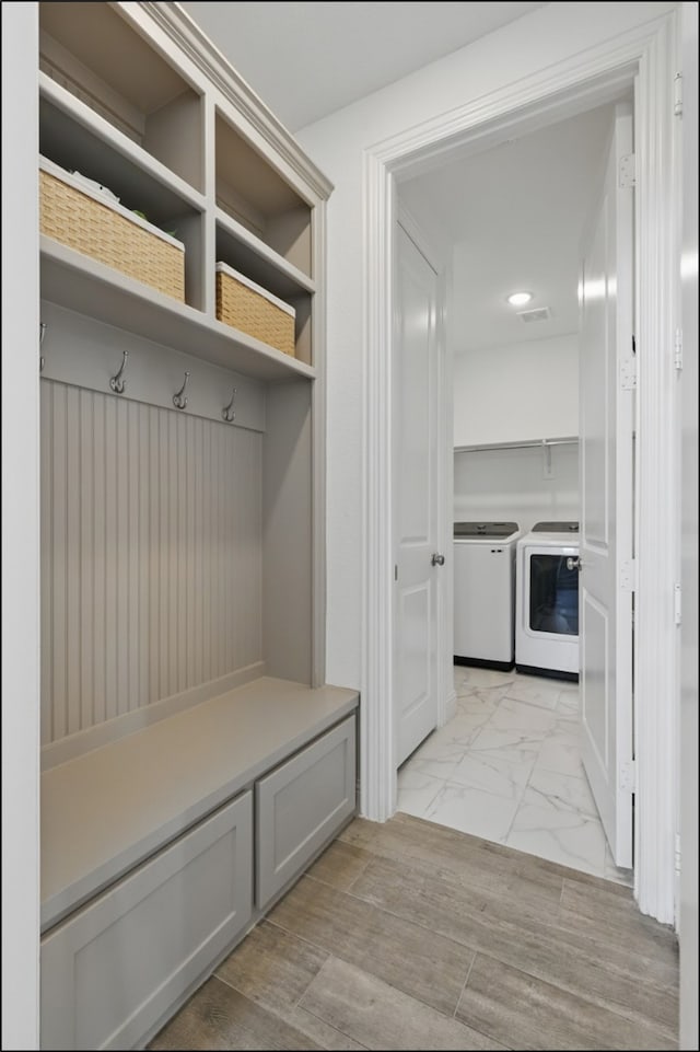 1001 Gentle Knoll Ln, Prosper, TX 75078 - mudroom with washer and dryer and light marble finish flooring