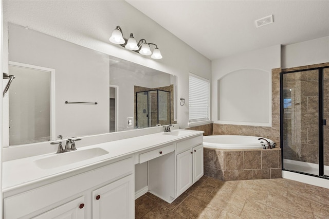 2408 Comal Ct, Royse City, TX 75189 - bathroom featuring a shower stall, a garden tub, double vanity, and tile patterned flooring