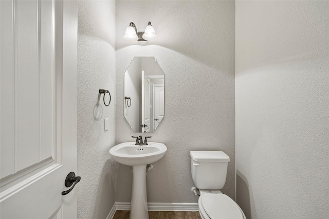 2408 Comal Ct, Royse City, TX 75189 - half bathroom featuring toilet and baseboards