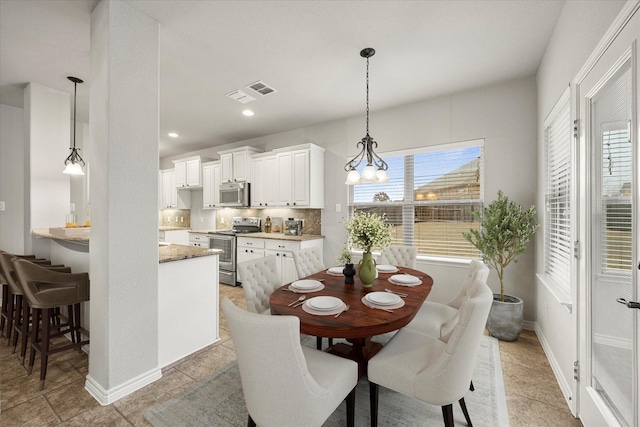 2408 Comal Ct, Royse City, TX 75189 - dining room with a chandelier, baseboards, and recessed lighting