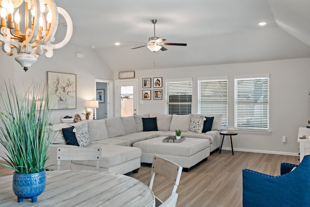 1517 Sweetwater Way, Celina, TX 75009 - living area with lofted ceiling, healthy amount of natural light, light wood finished floors, a chandelier, and ceiling fan