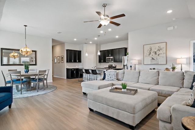 1517 Sweetwater Way, Celina, TX 75009 - living room featuring a chandelier, light wood-style floors, a ceiling fan, recessed lighting, and baseboards