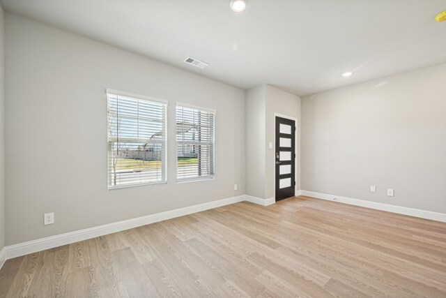 516 Stagg St, Mckinney, TX 75069 - empty room with light wood-style flooring, baseboards, and recessed lighting