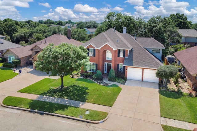 2221 Bennington Ave, Flower Mound, TX 75028 - colonial home with driveway, a chimney, a front lawn, and roof with shingles