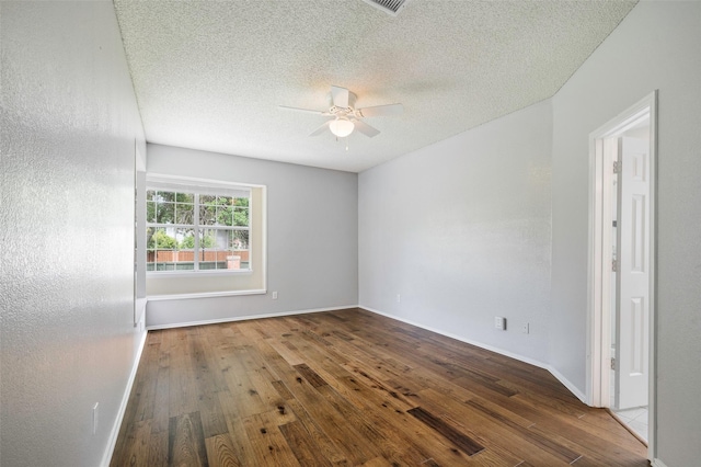 2221 Bennington Ave, Flower Mound, TX 75028 - unfurnished room featuring a ceiling fan, wood finished floors, a textured ceiling, and baseboards