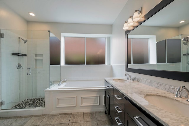 2221 Bennington Ave, Flower Mound, TX 75028 - bathroom with a shower stall, a bath, double vanity, tile patterned floors, and recessed lighting