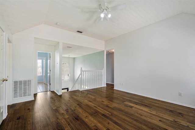 2221 Bennington Ave, Flower Mound, TX 75028 - empty room with dark wood-type flooring, ceiling fan, baseboards, and lofted ceiling