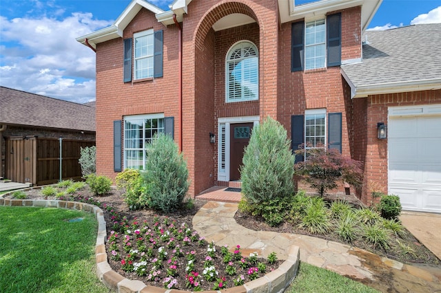 2221 Bennington Ave, Flower Mound, TX 75028 - view of front of home with brick siding, a garage, and a shingled roof