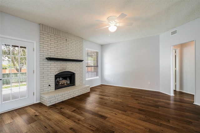 2221 Bennington Ave, Flower Mound, TX 75028 - unfurnished living room with ceiling fan, wood finished floors, healthy amount of natural light, and a textured ceiling