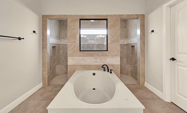 103 Saintsbury Cir, Waco, TX 76712 - bathroom featuring a jetted tub, baseboards, walk in shower, and tile patterned flooring