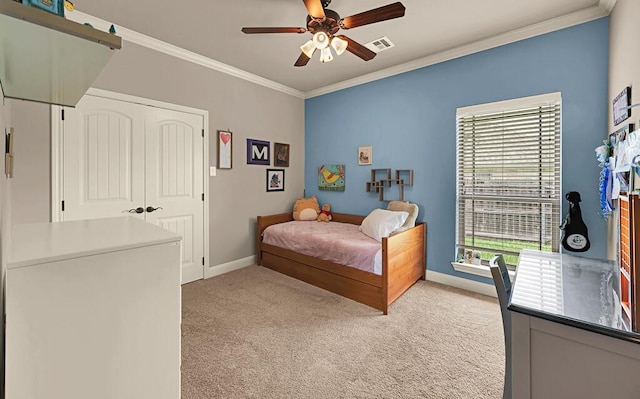 103 Saintsbury Cir, Waco, TX 76712 - bedroom with crown molding, light carpet, baseboards, a ceiling fan, and a closet