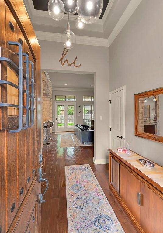 103 Saintsbury Cir, Waco, TX 76712 - entrance foyer featuring crown molding, dark wood-style floors, french doors, and baseboards