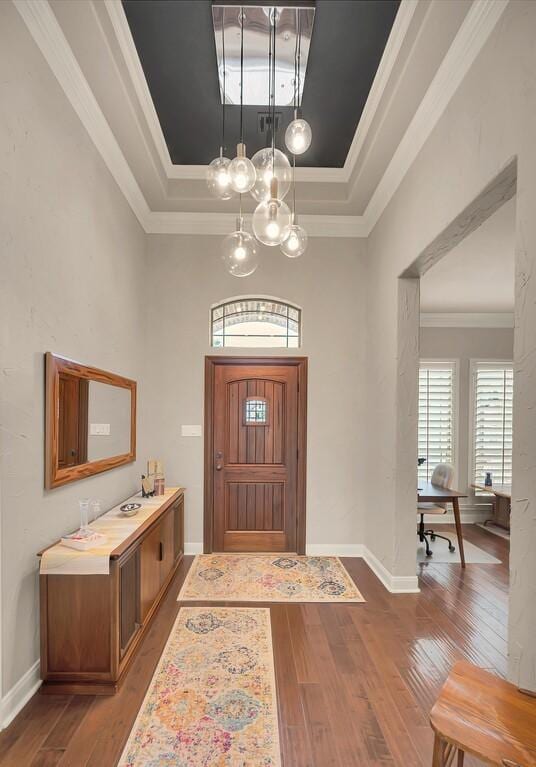 103 Saintsbury Cir, Waco, TX 76712 - entryway with a raised ceiling, hardwood / wood-style flooring, a chandelier, baseboards, and crown molding