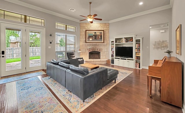 103 Saintsbury Cir, Waco, TX 76712 - living room featuring a fireplace, a ceiling fan, ornamental molding, dark wood-style flooring, and recessed lighting