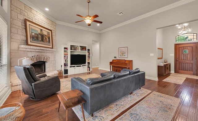 103 Saintsbury Cir, Waco, TX 76712 - living area with ornamental molding, a ceiling fan, dark wood-style flooring, a stone fireplace, and baseboards