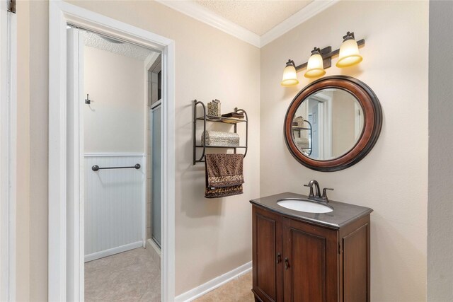 2507 16th St, Brownwood, TX 76801 - full bath featuring vanity, ornamental molding, a textured ceiling, and an enclosed shower