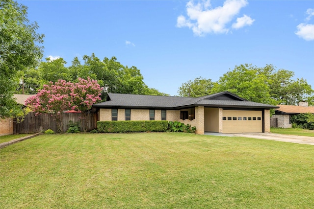 2507 16th St, Brownwood, TX 76801 - ranch-style house featuring an attached garage, driveway, and brick siding