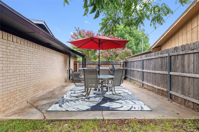 2507 16th St, Brownwood, TX 76801 - fenced backyard featuring outdoor dining area and a patio