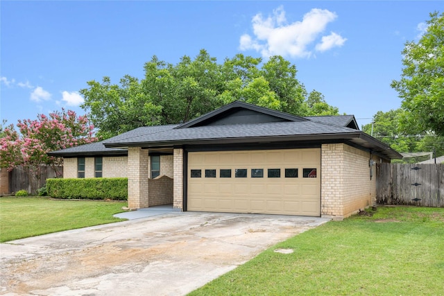2507 16th St, Brownwood, TX 76801 - view of front facade with brick siding, a garage, roof with shingles, and driveway